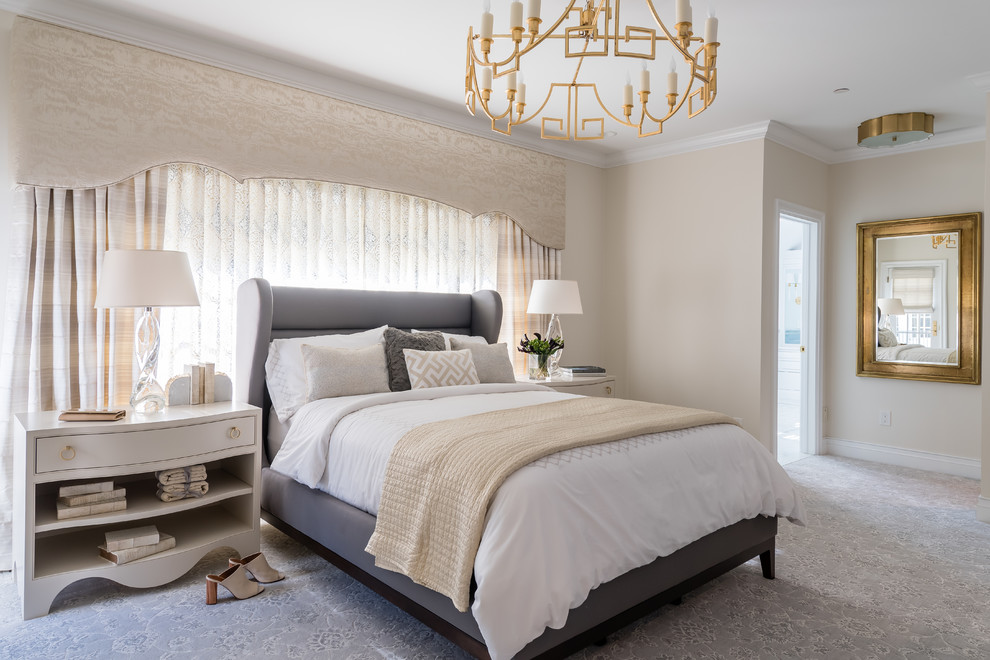 Large elegant master carpeted and gray floor bedroom photo in Cleveland with beige walls, a standard fireplace and a tile fireplace