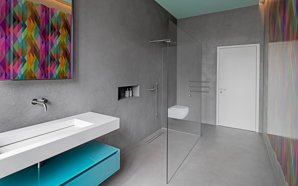 Design ideas for a mid-sized contemporary 3/4 bathroom in Frankfurt with turquoise cabinets, an open shower, grey walls, concrete floors, a trough sink, grey floor, an open shower, white benchtops and flat-panel cabinets.