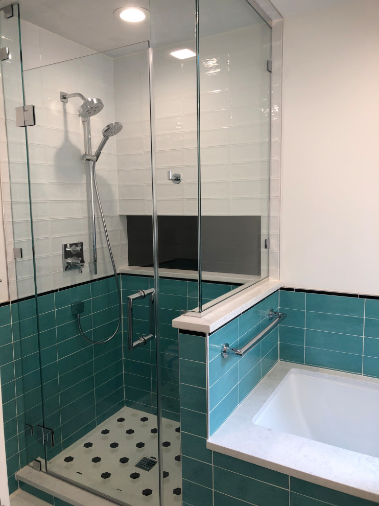 Photo of a small contemporary master bathroom in Raleigh with flat-panel cabinets, grey cabinets, a drop-in tub, a corner shower, a one-piece toilet, multi-coloured tile, ceramic tile, white walls, ceramic floors, an undermount sink, engineered quartz benchtops, multi-coloured floor, a hinged shower door and white benchtops.