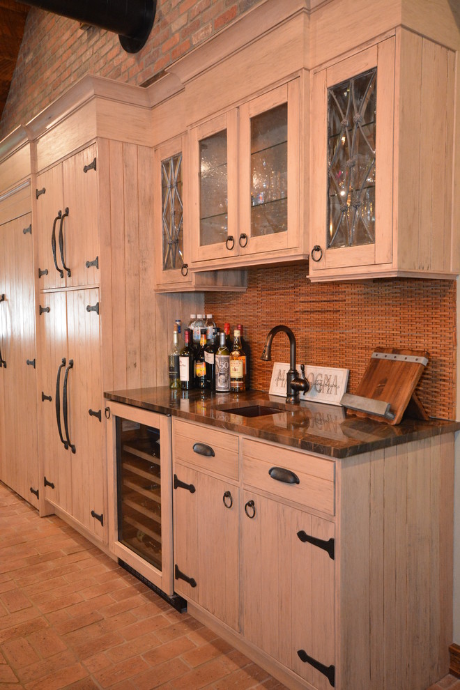 Large mountain style brick floor eat-in kitchen photo in New York with a farmhouse sink, beige cabinets, quartzite countertops and limestone backsplash