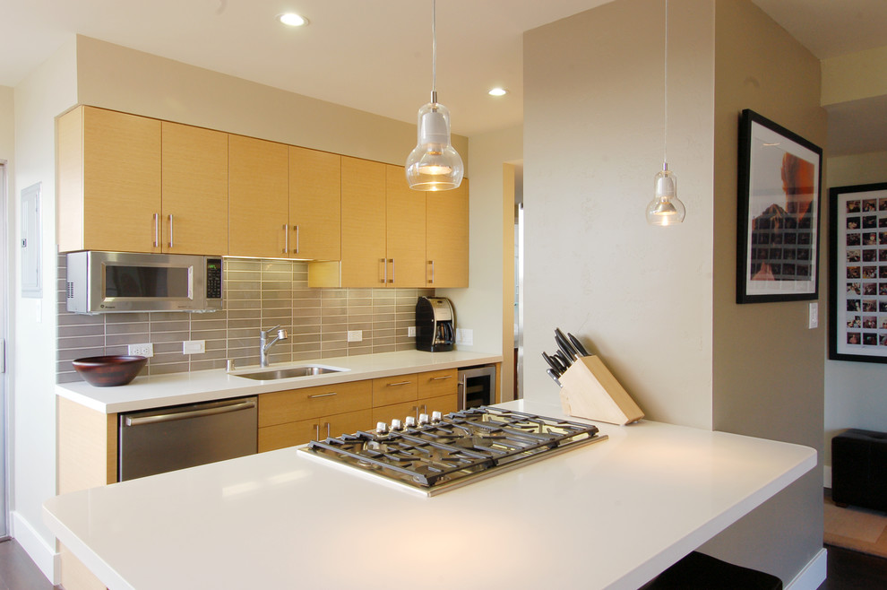 Design ideas for a contemporary kitchen in San Francisco with flat-panel cabinets and light wood cabinets.