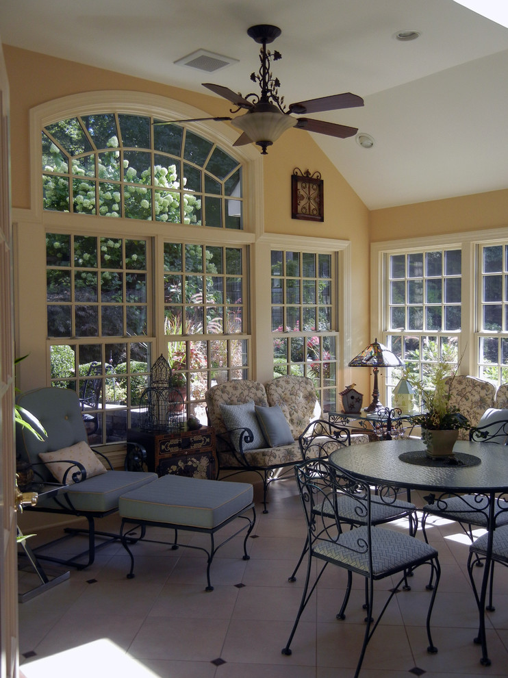 This is an example of a mid-sized traditional sunroom in New York with ceramic floors.