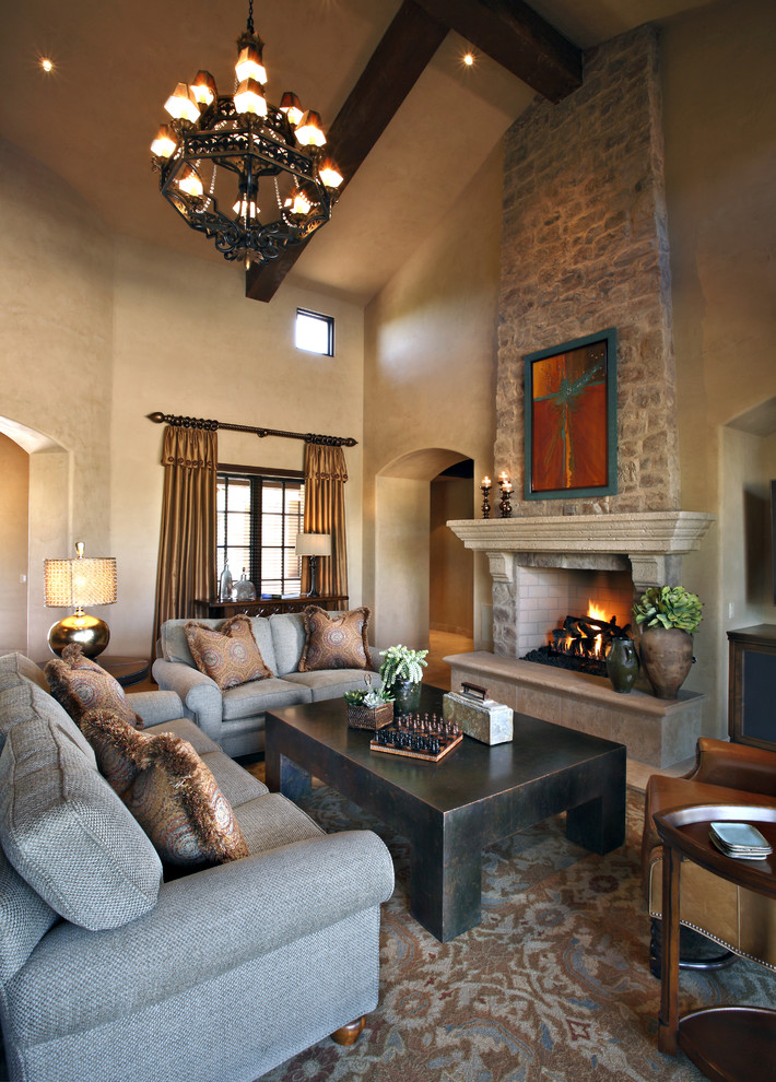 Inspiration for a traditional living room in Phoenix with beige walls and a standard fireplace.