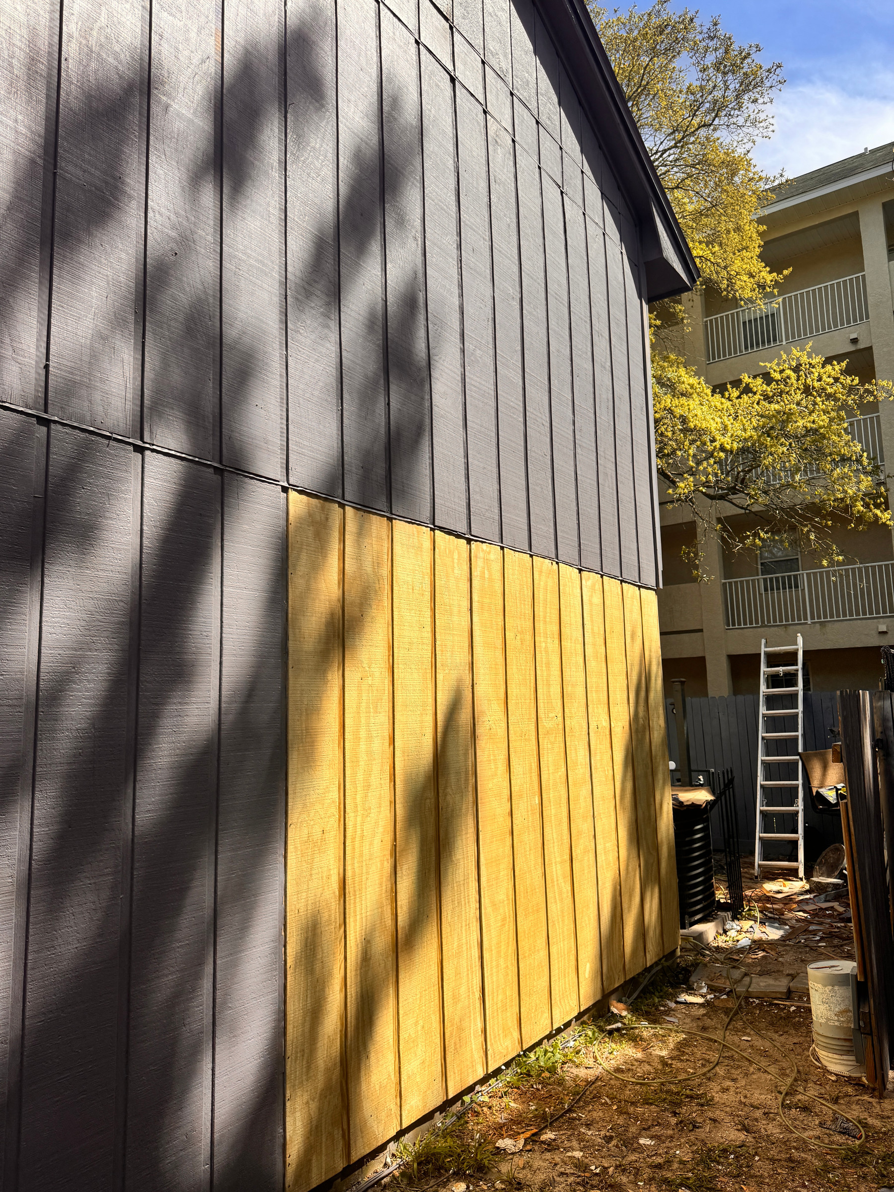 Fort Walton Beach — wood repairs and T1-11 panel replacement in progress