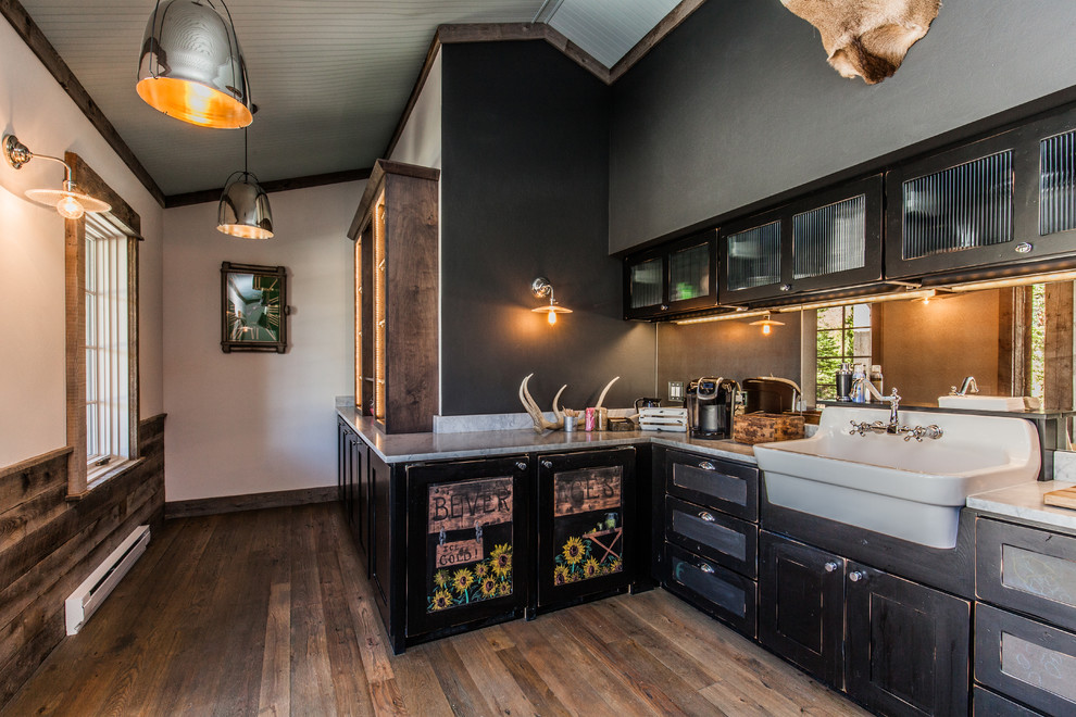 Mid-sized country u-shaped open plan kitchen in Other with a farmhouse sink, shaker cabinets, black cabinets, marble benchtops, mirror splashback, medium hardwood floors and no island.