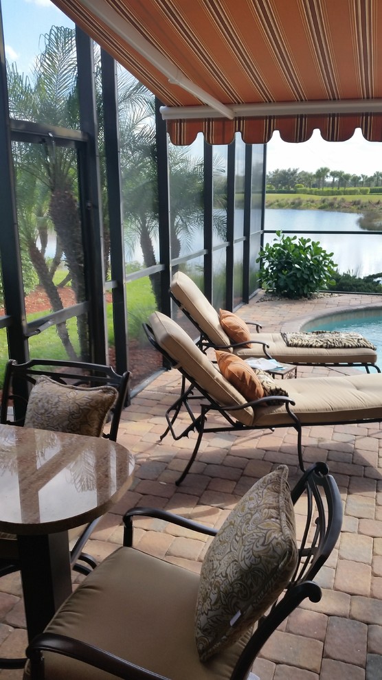 Example of a small transitional home design design in Miami