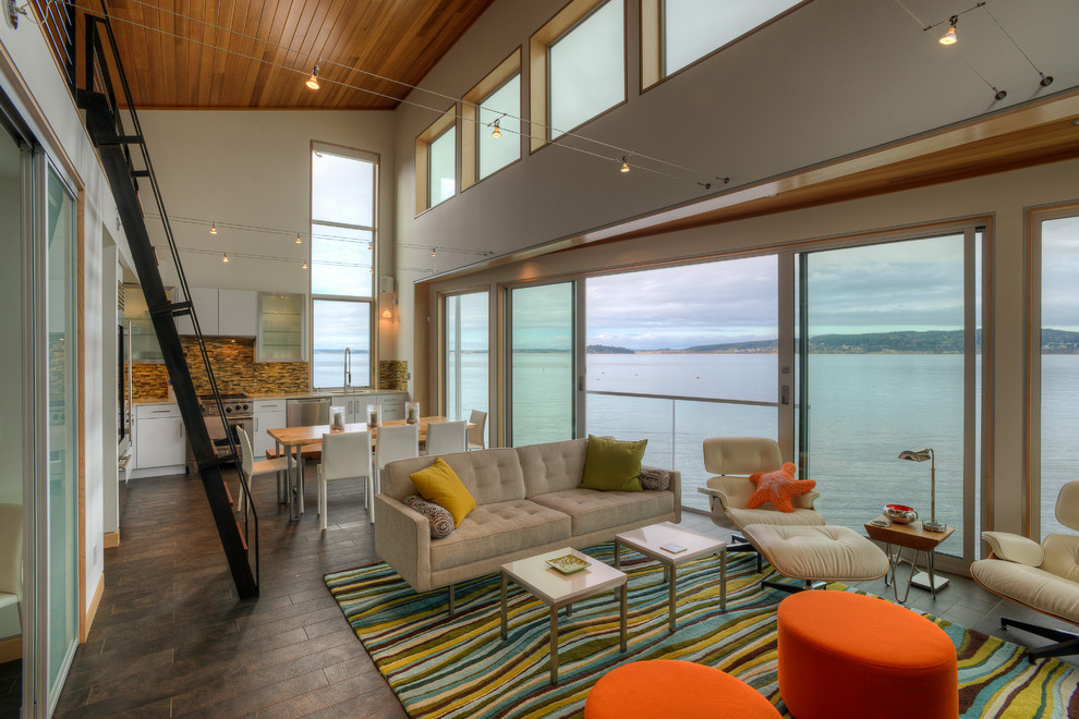 Beach style open concept painted wood floor living room photo in Seattle with white walls