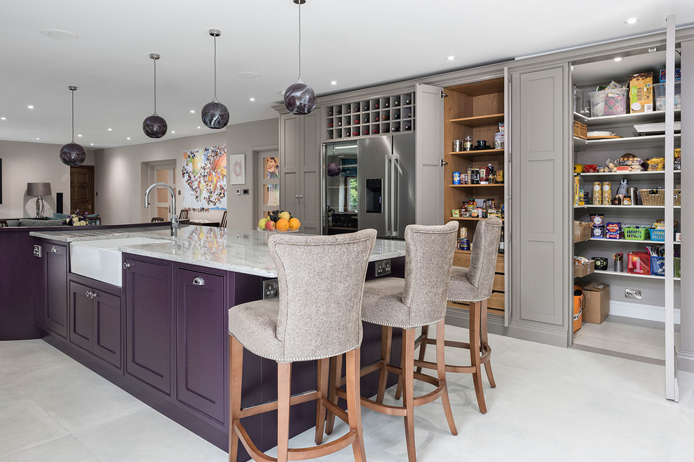 Inspiration for an expansive contemporary u-shaped open plan kitchen in Surrey with a farmhouse sink, shaker cabinets, purple cabinets, granite benchtops, beige splashback, glass sheet splashback, stainless steel appliances, ceramic floors, with island, grey floor and multi-coloured benchtop.
