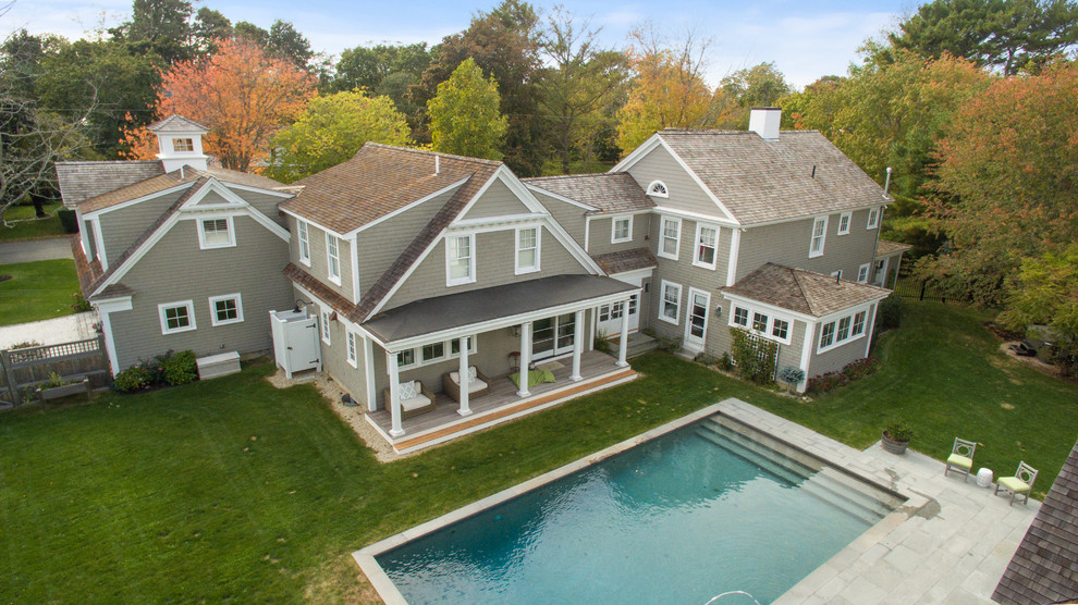 Example of a transitional home design design in Boston