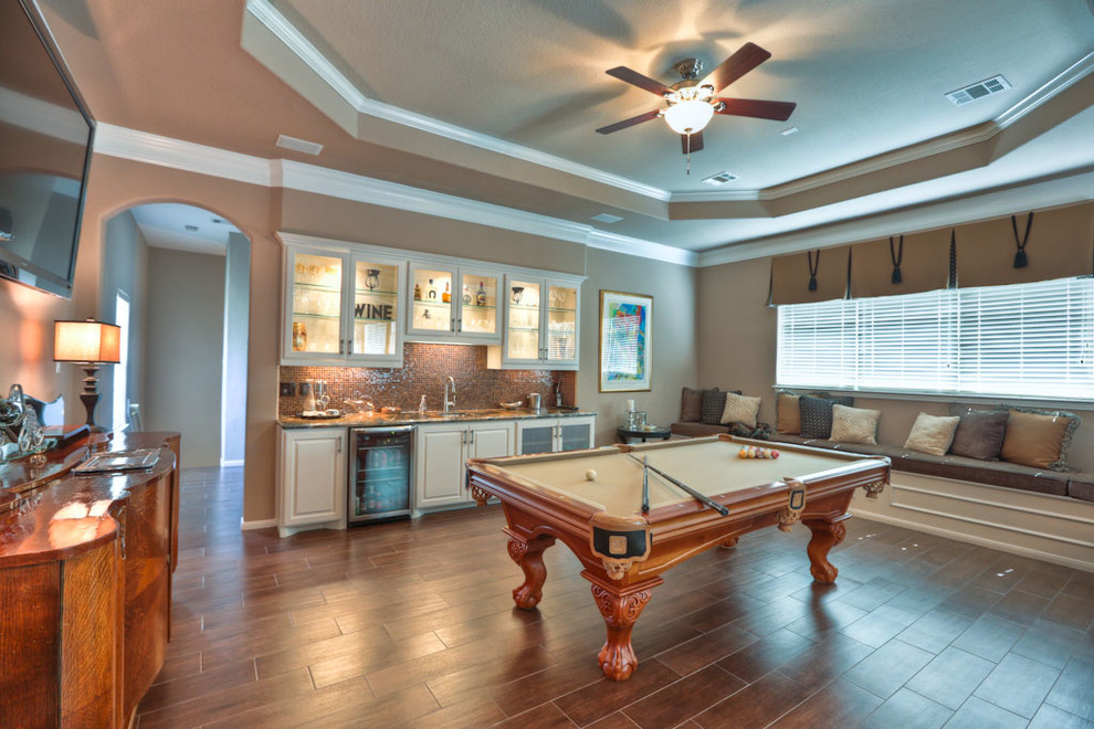 This is an example of a large traditional loft-style family room in Houston with a game room, beige walls and ceramic floors.