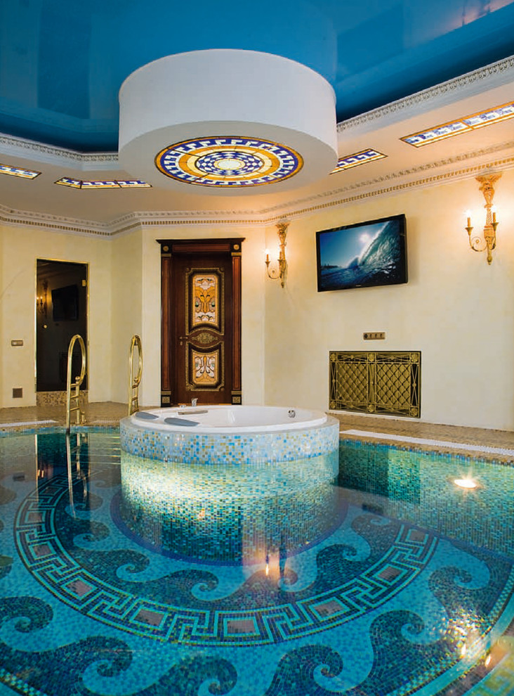 Design ideas for a large traditional indoor custom-shaped pool in Moscow with a water feature.