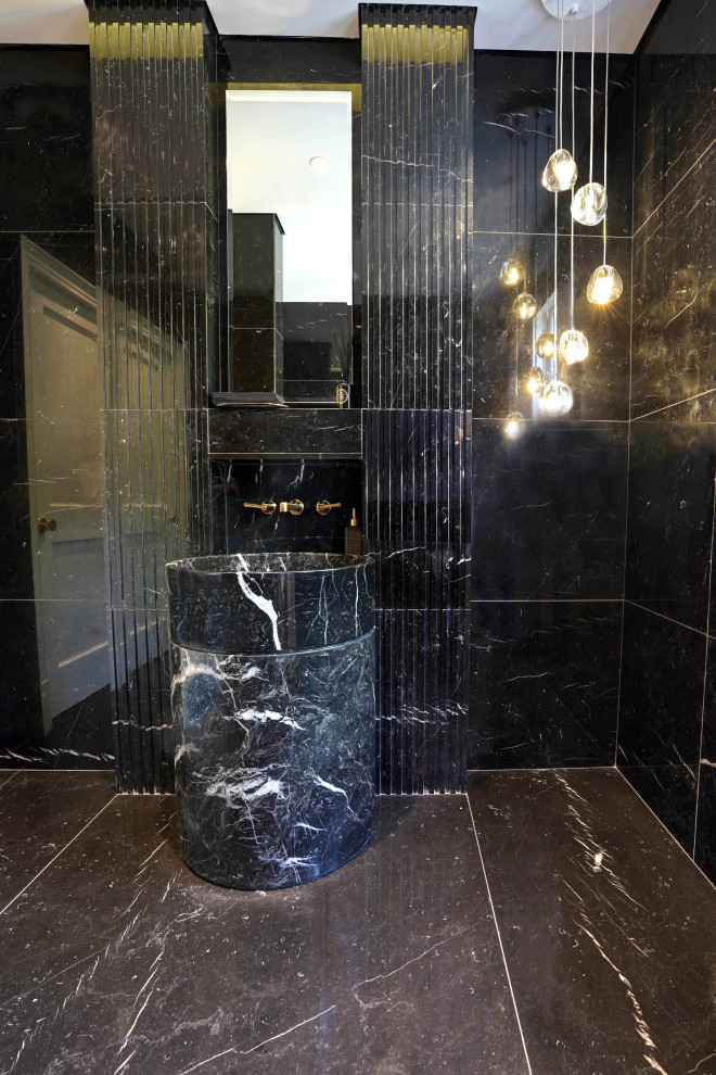 Carved Black Marble Pedestal Sink & Fluted Gold Sconces – Historic Renovation in