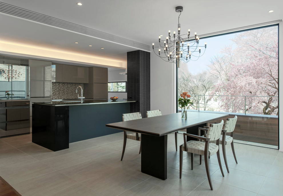 Inspiration for a contemporary kitchen/dining combo in Tokyo with white walls and grey floor.