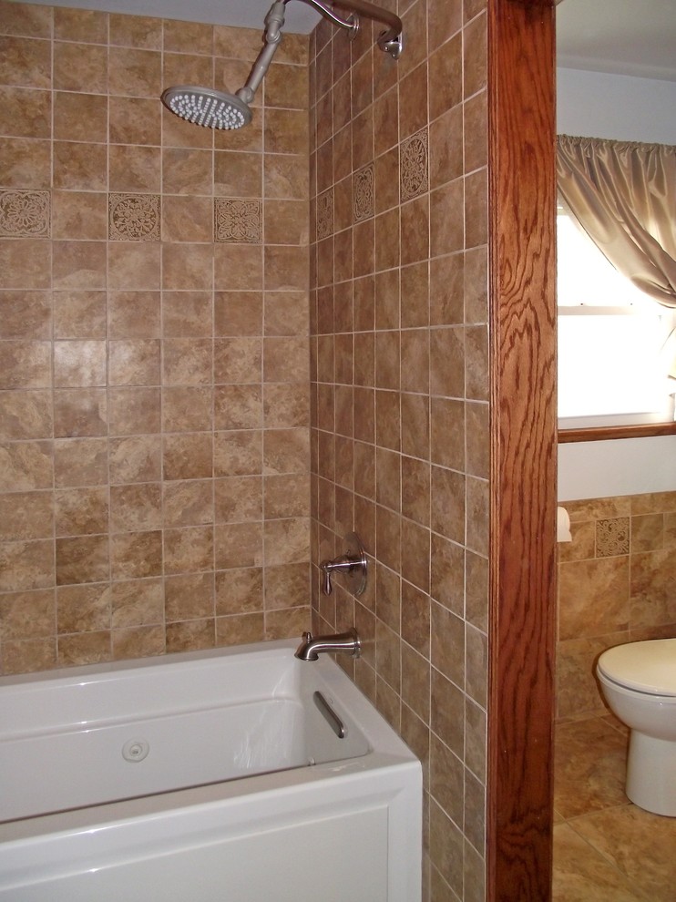 Example of a mid-sized classic brown tile and porcelain tile porcelain tile bathroom design in Wichita with a drop-in sink, a two-piece toilet and blue walls