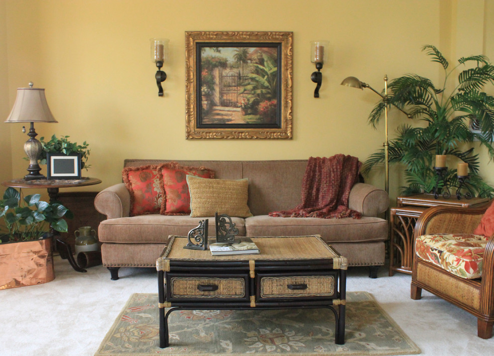 Inspiration for a mid-sized tropical formal living room in Baltimore with yellow walls, carpet and no fireplace.
