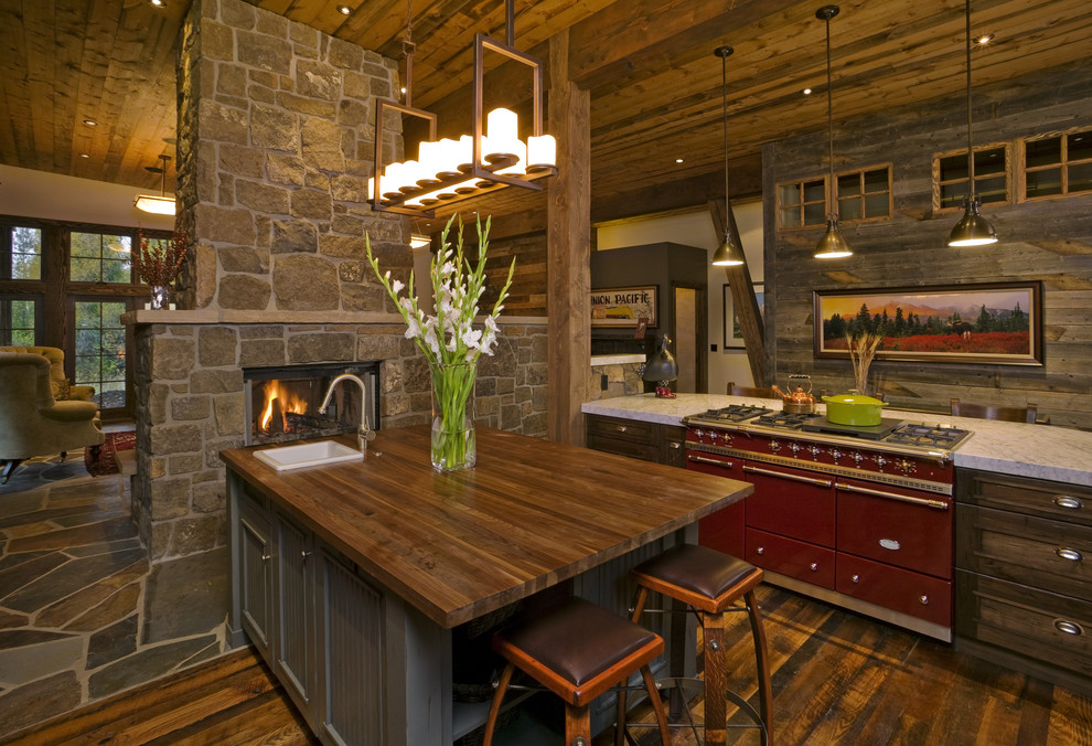 Photo of a country kitchen in Denver with wood benchtops and coloured appliances.