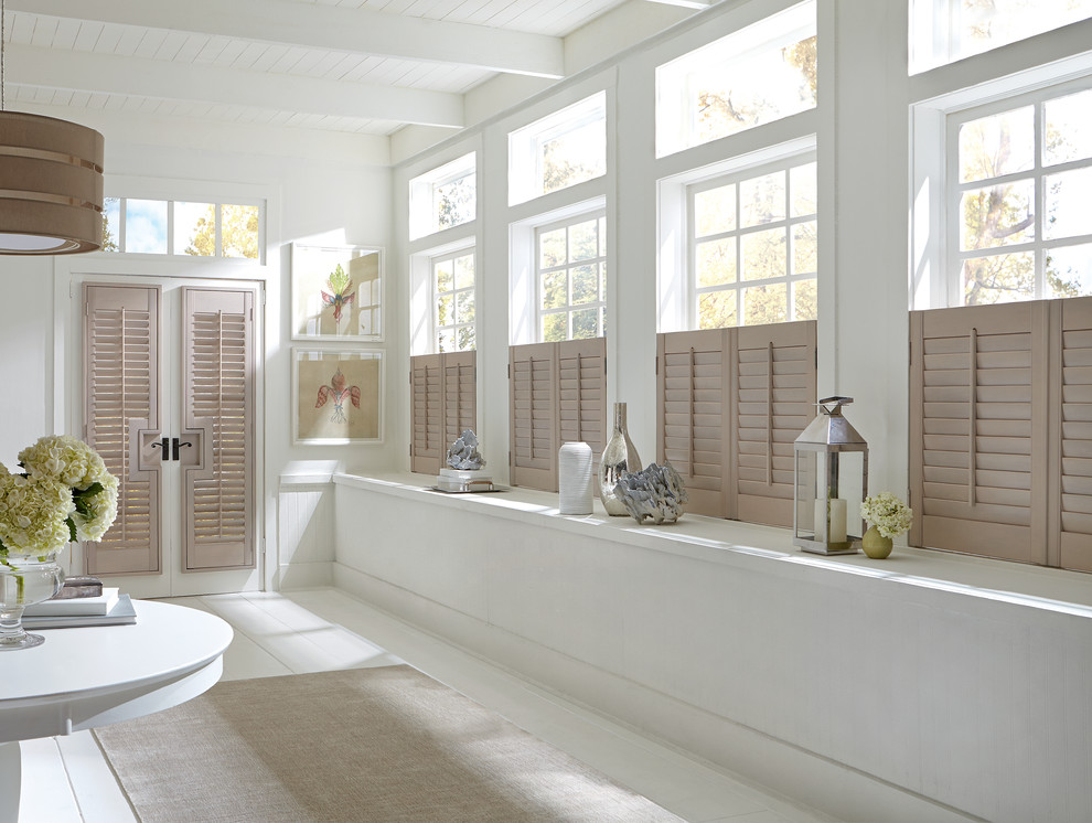 Example of a mid-sized transitional light wood floor bathroom design in Charleston with white walls