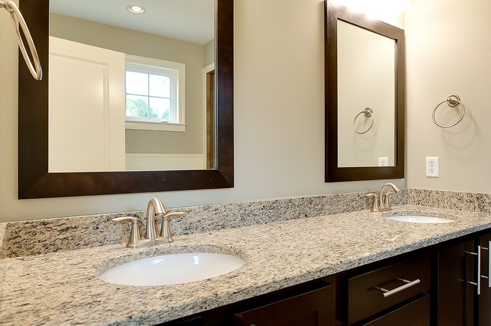 Bathroom - transitional bathroom idea with an undermount sink, flat-panel cabinets, dark wood cabinets and granite countertops