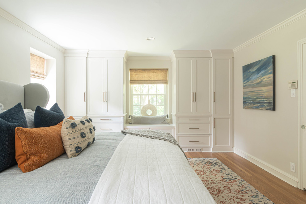 Example of a mid-sized transitional master medium tone wood floor and brown floor bedroom design in Philadelphia with gray walls and no fireplace