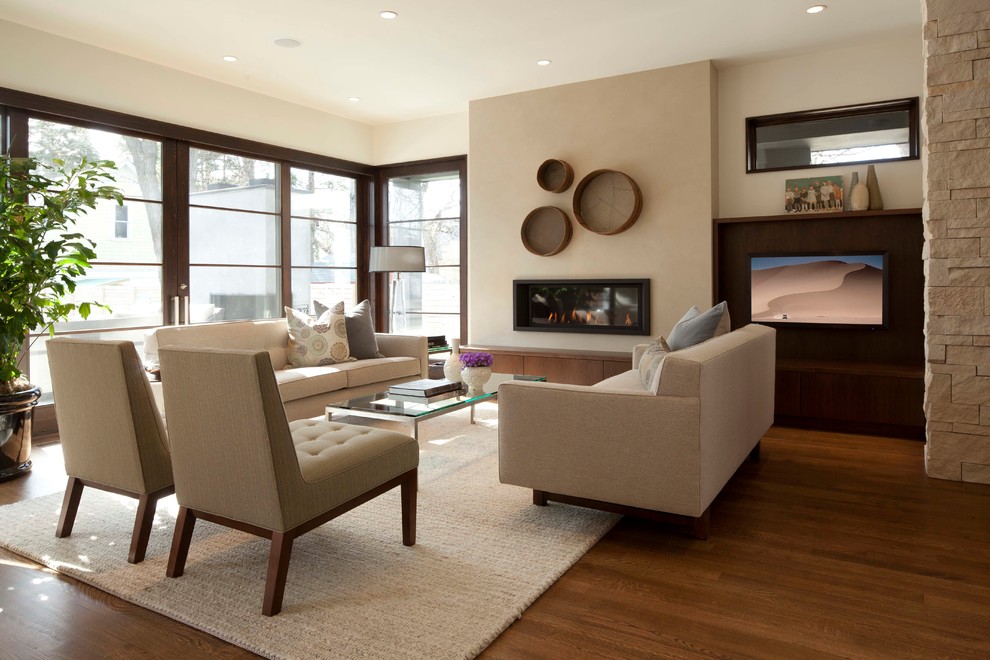 Design ideas for a contemporary living room in Minneapolis with beige walls and a ribbon fireplace.