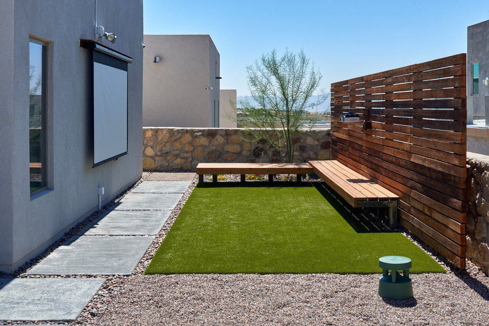 Small contemporary backyard patio in Other with concrete slab and no cover.