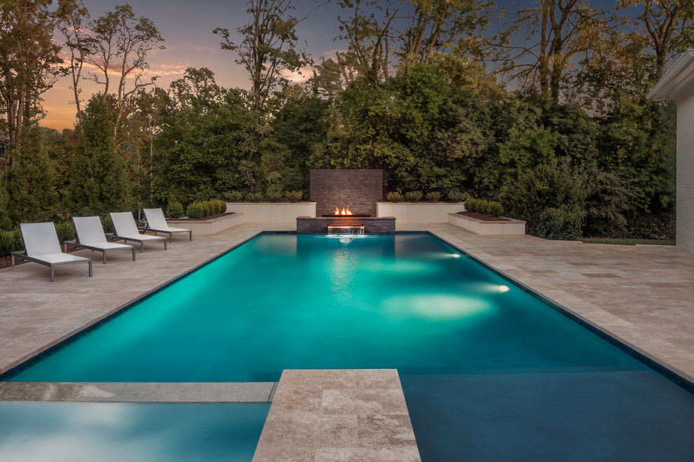 Inspiration for a transitional backyard rectangular lap pool in Charlotte with a hot tub and natural stone pavers.