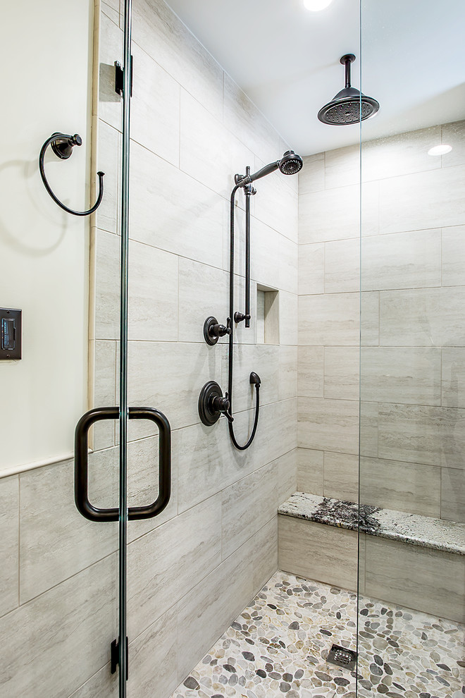 Example of a large mountain style master beige tile and porcelain tile porcelain tile and gray floor corner shower design in Richmond with dark wood cabinets, a two-piece toilet, gray walls, an undermount sink, granite countertops, a hinged shower door and shaker cabinets