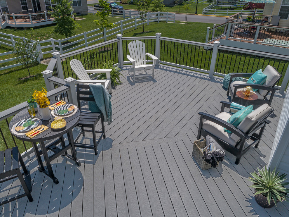 Mid-sized traditional backyard deck in Other with no cover.