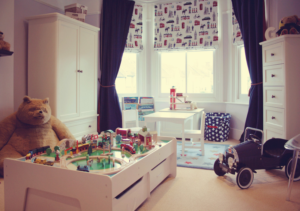 Inspiration for a large traditional kids' room for boys in London with carpet.