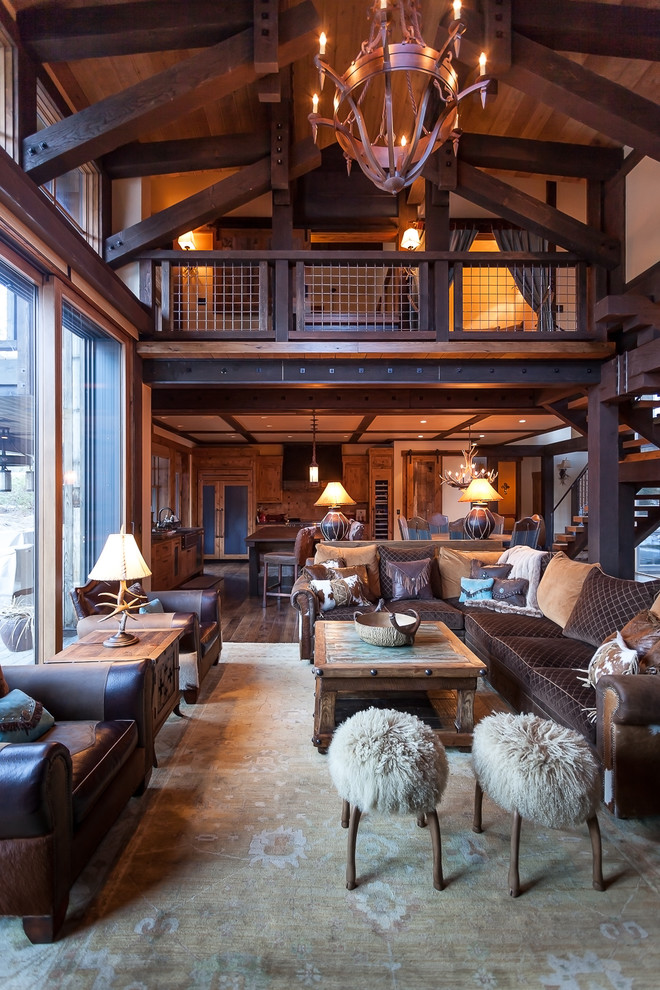 Example of a mountain style open concept dark wood floor living room design in Sacramento