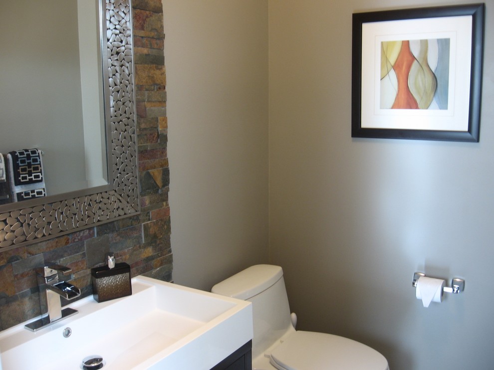 Design ideas for a transitional powder room in Toronto.