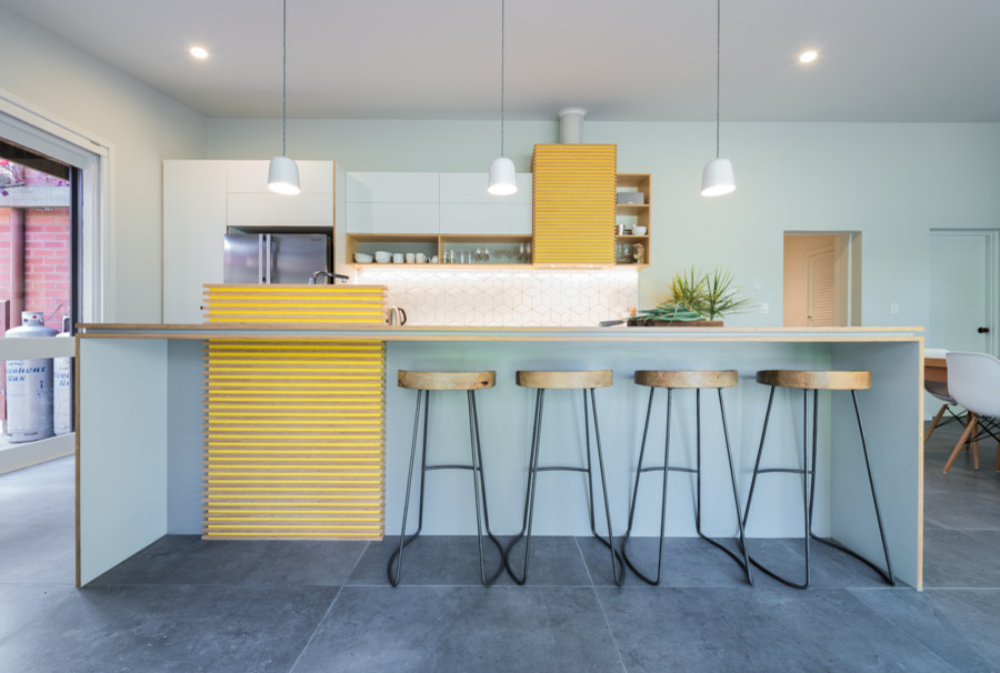 Design ideas for a large midcentury galley eat-in kitchen in Adelaide with an undermount sink, flat-panel cabinets, grey cabinets, laminate benchtops, white splashback, ceramic splashback, stainless steel appliances, ceramic floors and with island.