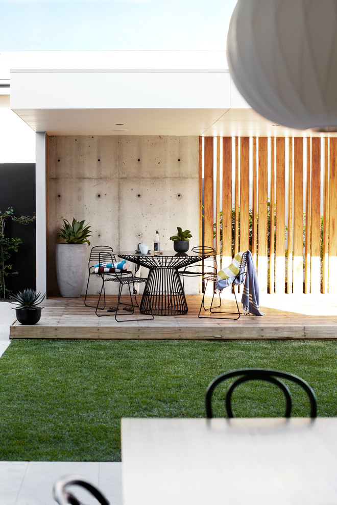 Design ideas for a small contemporary backyard deck in Sydney with an outdoor kitchen and a pergola.
