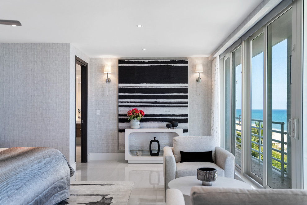 Mid-sized contemporary master bedroom in Miami with grey walls, marble floors, white floor and wallpaper.