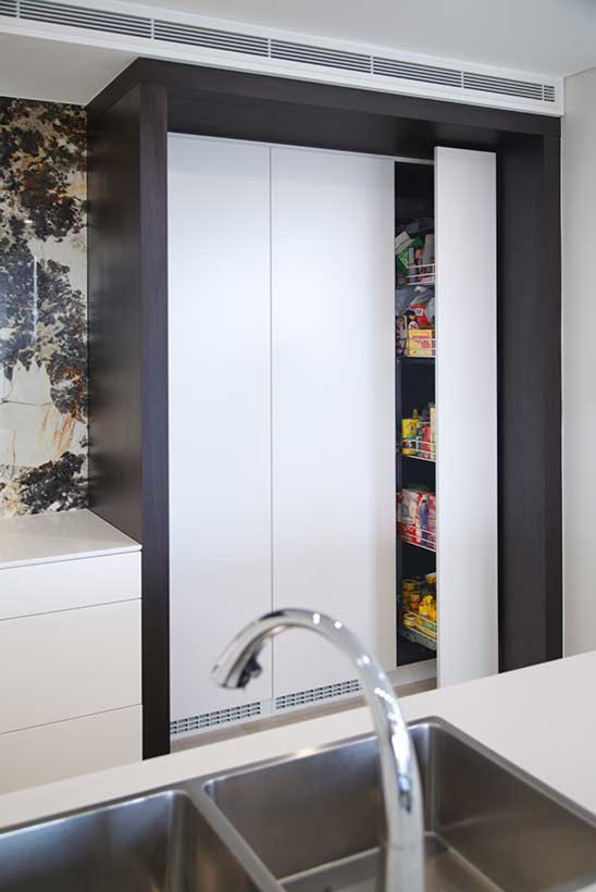 Design ideas for a small contemporary u-shaped eat-in kitchen with a double-bowl sink, white cabinets, quartz benchtops, multi-coloured splashback, stone slab splashback, stainless steel appliances and with island.