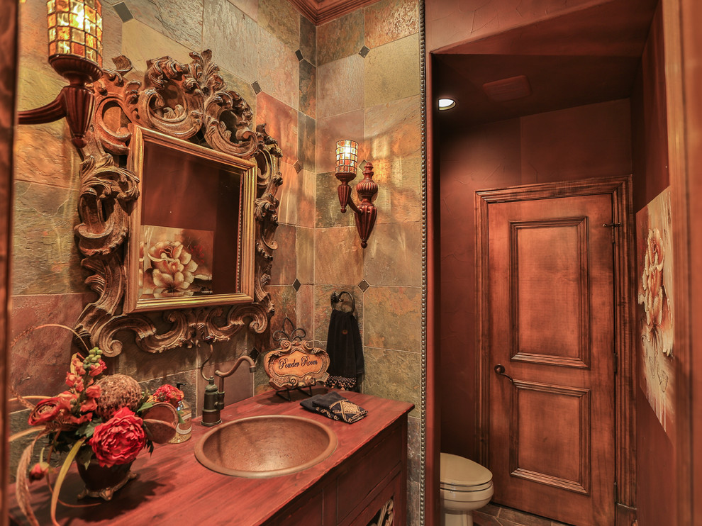 Inspiration for a mid-sized traditional master bathroom in Dallas with flat-panel cabinets, brown cabinets, a two-piece toilet, beige tile, brown tile, ceramic tile, beige walls, ceramic floors, a drop-in sink, wood benchtops and beige floor.