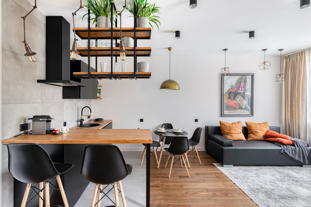 Студия в стиле лофт для холостяка: зона кухни-гостиной