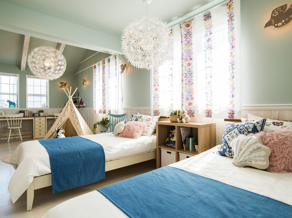 Eclectic kids' bedroom in Other with green walls, beige floor and plywood floors for girls.