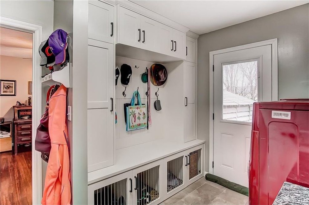 Photo of a transitional laundry room in Other with a side-by-side washer and dryer.