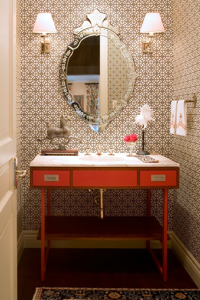 Photo of a small eclectic powder room in Denver with flat-panel cabinets, red cabinets, multi-coloured walls, dark hardwood floors, an undermount sink and marble benchtops.