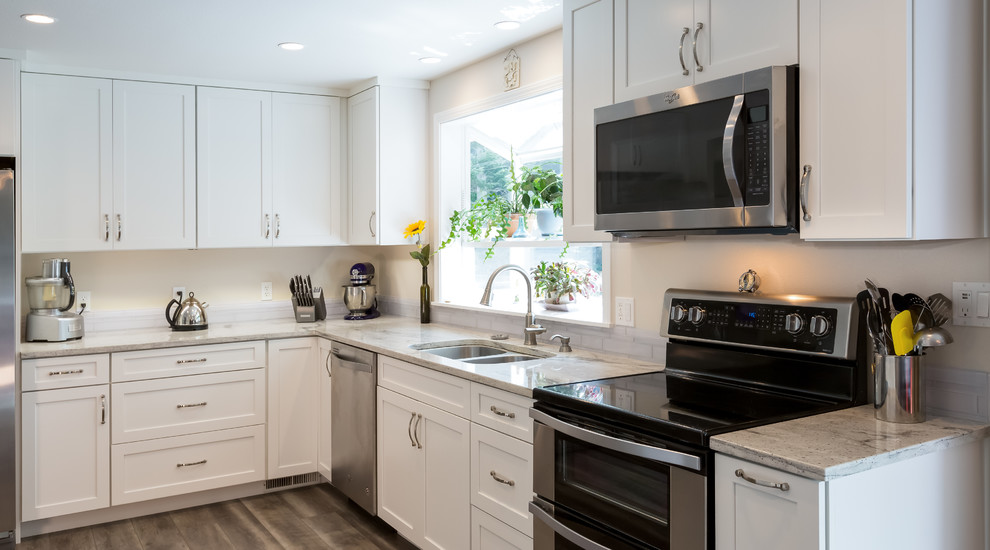 Example of a mid-sized transitional kitchen design in Seattle