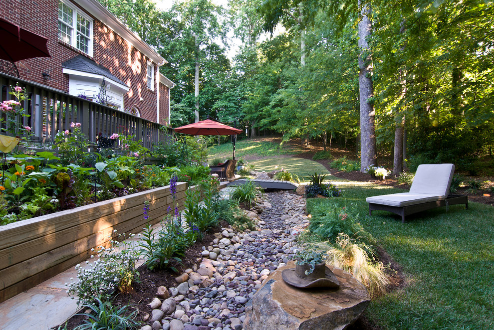 Traditional garden in Charlotte with with raised garden bed.