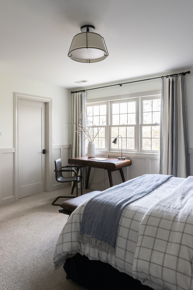 Derby House Kids Wing - Newly remodeled boys bedroom with new batten board wainscoting, closet doors, trim, paint, lighting, and new loop wall to wall carpet. Queen bed with windowpane plaid duvet. Photo by Emily Kennedy Photography.