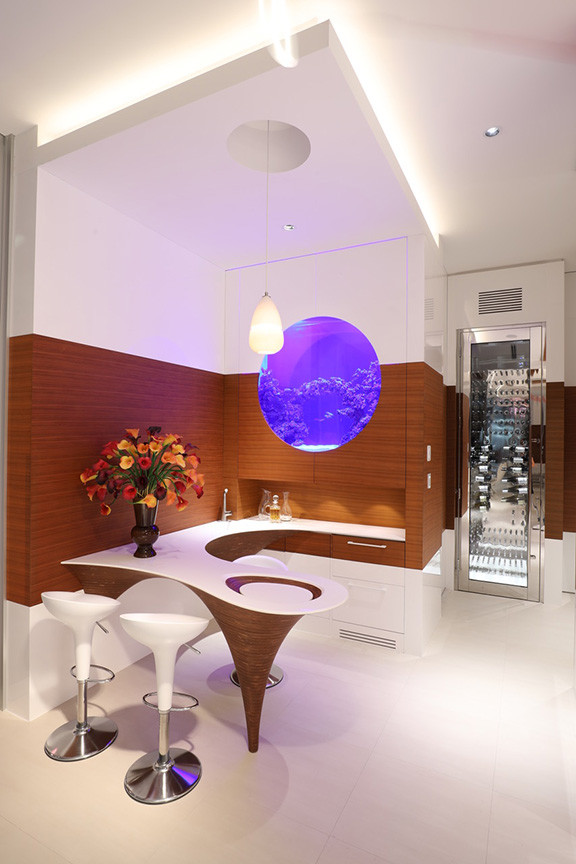 This is an example of a contemporary seated home bar with no sink, flat-panel cabinets, white cabinets, brown splashback, timber splashback and white floor.