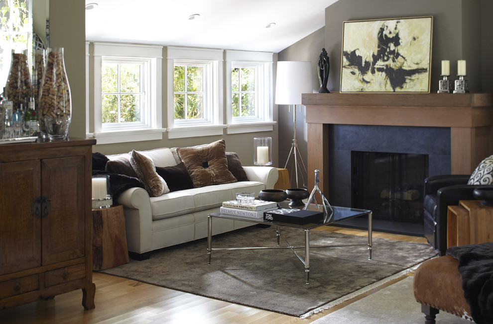 Photo of a transitional enclosed living room in San Francisco with grey walls and a standard fireplace.