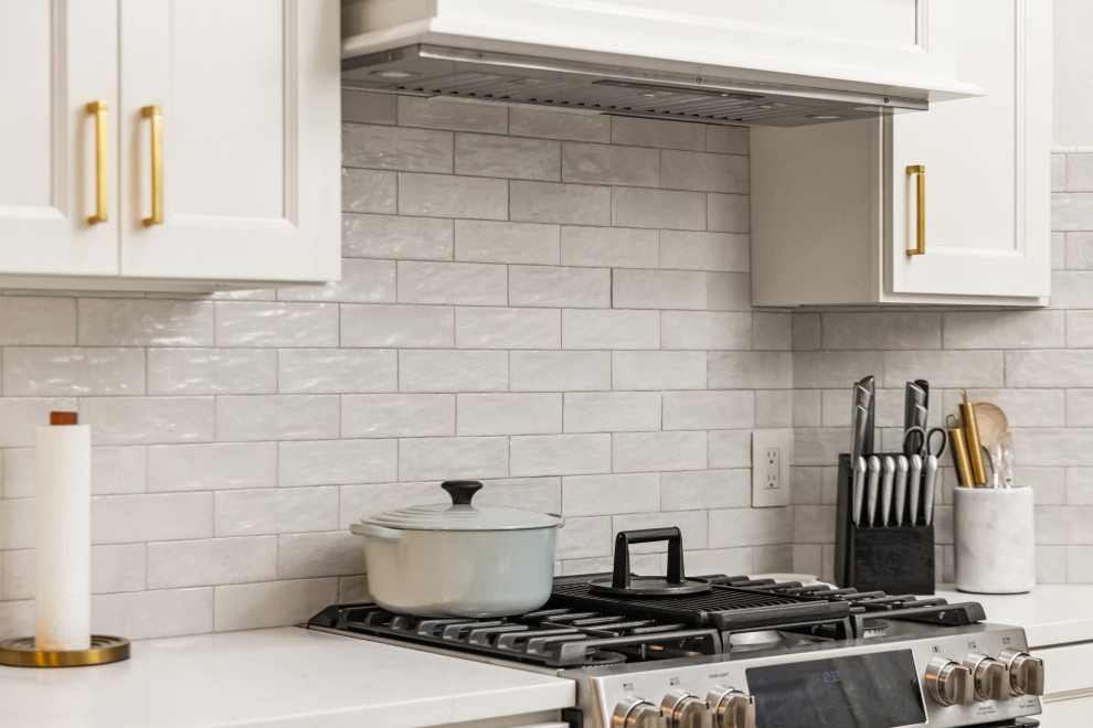 Eat-in kitchen - small transitional l-shaped light wood floor and multicolored floor eat-in kitchen idea in Tampa with an undermount sink, shaker cabinets, beige cabinets, quartzite countertops, beige backsplash, porcelain backsplash, stainless steel appliances, a peninsula and white countertops