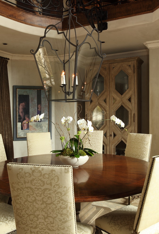 This is an example of a traditional dining room in Nashville with grey walls and no fireplace.