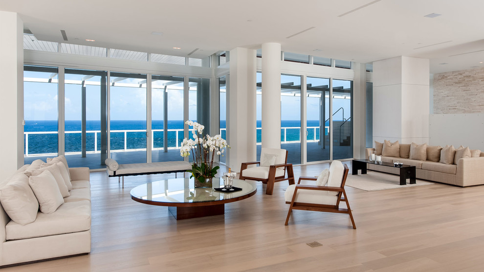 This is an example of a beach style open concept living room in Miami.