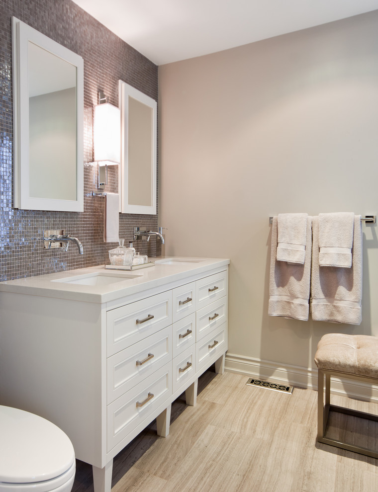 Photo of a transitional bathroom in Toronto with mosaic tile.