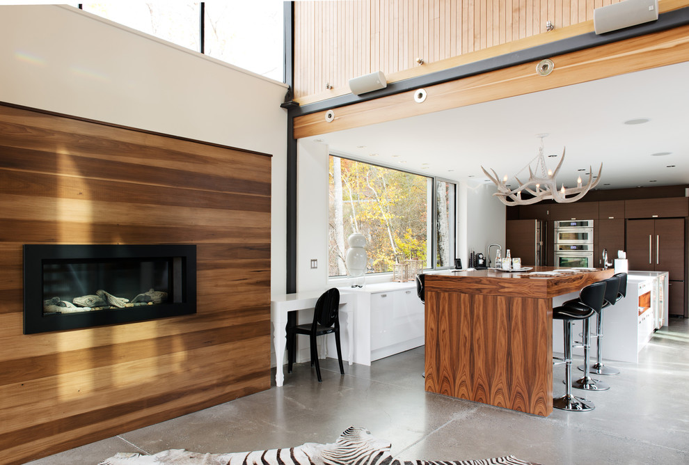 Contemporary kitchen in Montreal with wood benchtops.